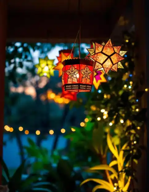 Colorful Diwali lantern and star lights hanging outdoors with plants and bokeh lights in the background | Diwali Lantern and Star Lights Setup | Diwali Festival Outdoor Decoration | Decorations Guru