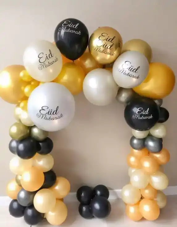 Eid Mubarak balloon arch with gold, black, and white balloons for Eid celebration at home | Elegant Eid Mubarak Balloon Arch for Home Celebrations | Eid Home Decor | Decorations Guru