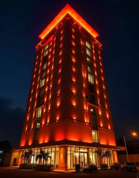 High-rise building illuminated with festive Diwali lights in vibrant orange hues | Diwali Lighting Decoration on High-Rise Building | Outdoor Lighting | Decorations Guru